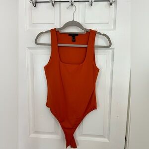 Orange body suit